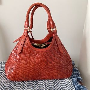 Cole Haan rust orange Genevieve triangular bag
